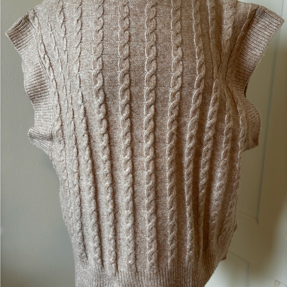 Cable sweater vest.
